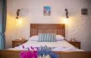 Kamar Tidur 3 Stone Garden Tas Hotel