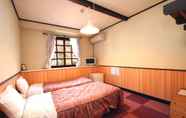 Kamar Tidur 4 Pension Flower Garden