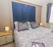 Bedroom 6 Charming Lodge Located on Cayton Bay Holiday Park
