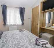 Bedroom 3 Charming Lodge Located on Cayton Bay Holiday Park