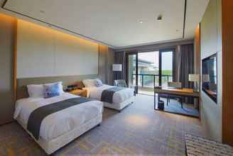 Bedroom 4 Howard Johnson by Wyndham Glory Plaza Qidong