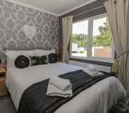 Bedroom 3 Impeccable 3-bed Lodge at Cayton Bay Holiday Park