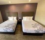 Kamar Tidur 4 SureStay Plus Hotel by Best Western Ada