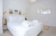 Bedroom 3 Stylish & Modern 3 Bed Flat in NW London With Garden