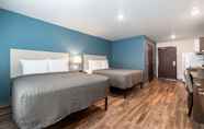 Bedroom 6 WoodSpring Suites Sanford North I-4 Orlando Area