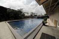 Swimming Pool Homey and Tranquil 2BR Apartment at Galeri Ciumbuleuit 2