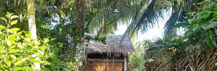 Bên ngoài Peaceful Homestay in the Middle of Fruit Garden - Room With Public Restroom