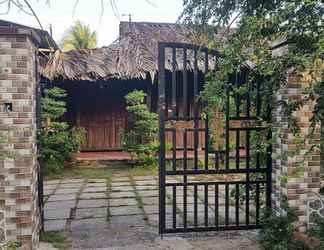 Exterior 2 Peaceful Homestay in the Middle of Fruit Garden - Room With Four Double Beds