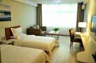 Kamar Tidur Mellow Orange Hotel