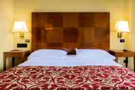 Kamar Tidur Hotel King - by R Collection Hotels