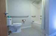 In-room Bathroom 4 Super 8 by Wyndham Branson / Shepherd of the Hills Exwy