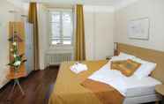 Bedroom 2 Hôtel Alpes & Lac