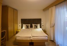 Bedroom 3 Hotel Corona Wellness & Family