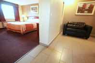 Kamar Tidur Travel Inn & Suites