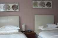 Kamar Tidur Warwick Lodge Guesthouse