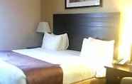 Bedroom 7 Days Inn & Suites by Wyndham Winnipeg Airport Manitoba