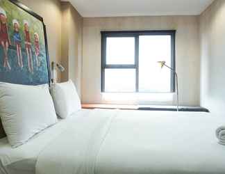 Bedroom 2 Cozy and Modern Studio Apartment at Belmont Residence Puri