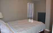 Bedroom 3 The Stone Castle - With Private Yard & Parking, Near Falls & Casino by Niagara Hospitality