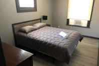 Bedroom The 540 With Private Yard & Parking, Near Falls & Casino by Niagara Hospitality