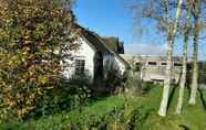 Exterior 5 Quaint Holiday Home in Gerkesklooster with Hot Tub, Sauna & Fenced Garden