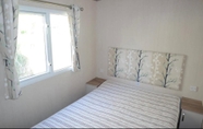 Bedroom 5 Comfortable 3-bed Caravan - Combe Haven