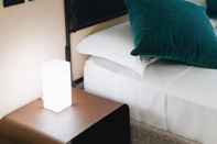 ห้องนอน Leano Agriresort - Deluxe Double Room