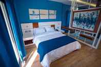 Kamar Tidur Travelholic Inn