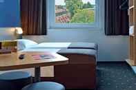 Bedroom B&B Hotel Stuttgart-Neckarhafen