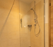 In-room Bathroom 5 Tevini Boutique Suites by we rent