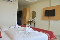 Kamar Tidur Click Hotel Yatharth Inn