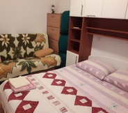 Bedroom 2 Impeccable 3-bedrooms Apartment in Rab 1-9 Pers