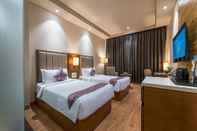 Kamar Tidur Hotel Cachar Club by Siara