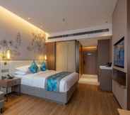 Bedroom 5 Huatuo platinum Garden Hotel