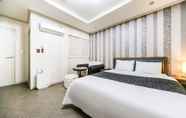 Kamar Tidur 5 Gumi Modern Business Hotel