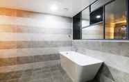 In-room Bathroom 4 Muan Hotel The K