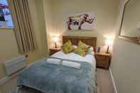 Kamar Tidur Heart of the City - Stylish Modern Apartment