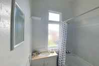 In-room Bathroom Bright and Modern Oasis in Kingsland