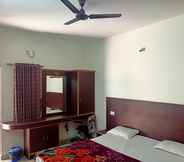 Bedroom 4 Madha Home Resorts