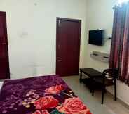 Bedroom 7 Madha Home Resorts