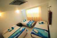 Kamar Tidur Hotel On Vacation Coral Flower