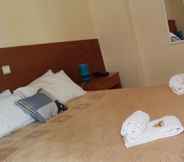 Bedroom 3 Parthenis Riviera Hotel