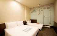 Bedroom 6 Ximen Holiday Fun Hotel