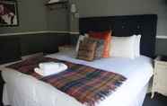 Kamar Tidur 6 Worplesdon Place Hotel