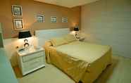 Phòng ngủ 2 Nobile Suites Tambaú