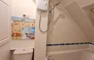 In-room Bathroom 5 Grace Apartments - Living Stream 1