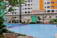 Swimming Pool Comfortable 2BR at Green Pramuka City Apartment Direct Access to Mall