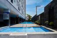 Swimming Pool Trendy and Tidy Studio Room at Puri Mas Apartment