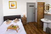 Kamar Tidur Cades Accommodation