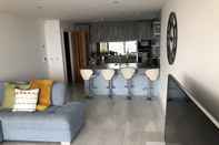 Common Space No2 Sandy Bay , Luxury Beachfront Apartment