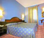 Bilik Tidur 5 Aparthotel Vacances Menorca Blanc Cottage